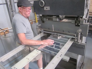 An arbor press set up to make the a small bend
                    required in the fabrication of a Cessna lower
                    aileron skin