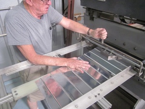 An arbor press set up to make the a small bend
                    required in the fabrication of a Cessna lower
                    aileron skin
