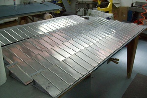 An arbor press set up to make the a small bend
                    required in the fabrication of a Cessna lower
                    aileron skin